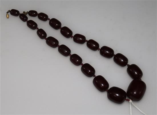 A cherry amberoid necklace.